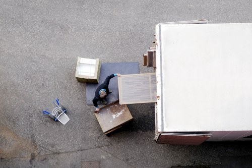 Movers maintaining safe access and tidy working conditions in a property